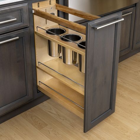 It can be tough to find the right spot that keeps your kitchen utensils organized, yet easily accessible. That's where our Base Pull-Out customization comes in! With its adjustable shelving and spacious utensil bins, your kitchen essentials can be tidily tucked away while also being within reach when you need them. #bertch #bertchcabinets #cabinets #utensildrawer #kitchenstorage #storagehack #storageideas Utensil Holder For Cabinet, Kitchen Utensils Organization, Organizing Ideas Kitchen, Pantry Organizing Ideas, Utensil Cabinet, Kitchen Pull Out Drawers, Kitchens Storage, Utensils Drawer, Bertch Cabinets