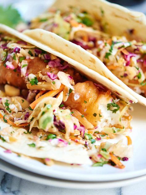 Beer Battered Fish Tacos - Fried Cod Tacos w/ Asian Slaw Fried Cod Fish Tacos, Tacos Fried, Fresh Coleslaw, Cod Tacos, Fried Cod Fish, Cod Fish Tacos, Seafood Tacos, Fish Tacos With Cabbage, Fried Fish Tacos