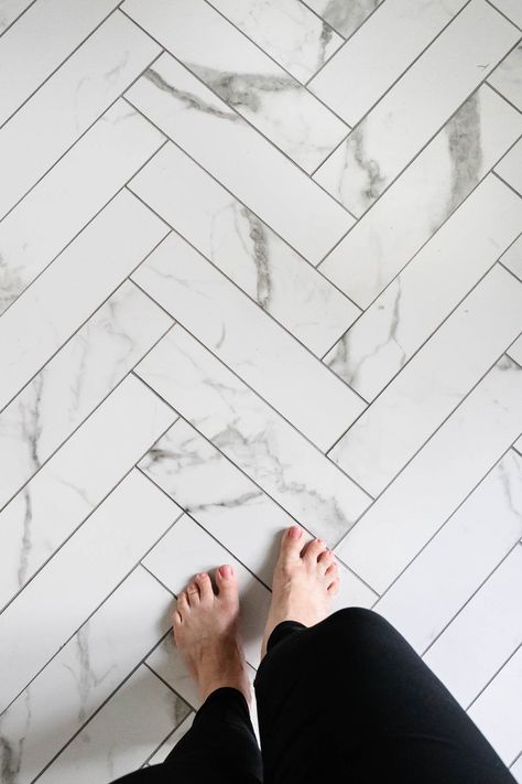 faux marble herringbone tile floor with gray grout Small Shower Renovation, Herringbone Tile Shower Wall, Shower Marble Tile, Marble Tiles Kitchen, Herringbone Shower Floor, Marble Tile Shower, Shower Marble, Herringbone Tile Bathroom, Marble Tile Kitchen