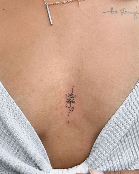 Unveil the allure of small rib tattoos with these exquisite fine line designs! Perfect for women seeking a blend of subtlety and charm, these simple yet captivating tattoos adorn your rib cage with delicate floral details. Explore the beauty of minimalism and express your unique style effortlessly#SmallRibTattoos #WomenWithInk #FloralTattoos #InkInspiration #MinimalistInk #ChicTattoos #SubtleBeauty #RibCageArt #FeminineInk #TattooTrends Small Rose Tattoo On Back, Small Rose Tattoo No Stem, Crease Of Arm Tattoo, Rose Fine Line Tattoo Design, Cute Hidden Tattoos For Women, Rosebud Tattoo Simple, Under Noon Tattoo, Princess Aesthetic Tattoo, Tattoo Ideas In Between Breast