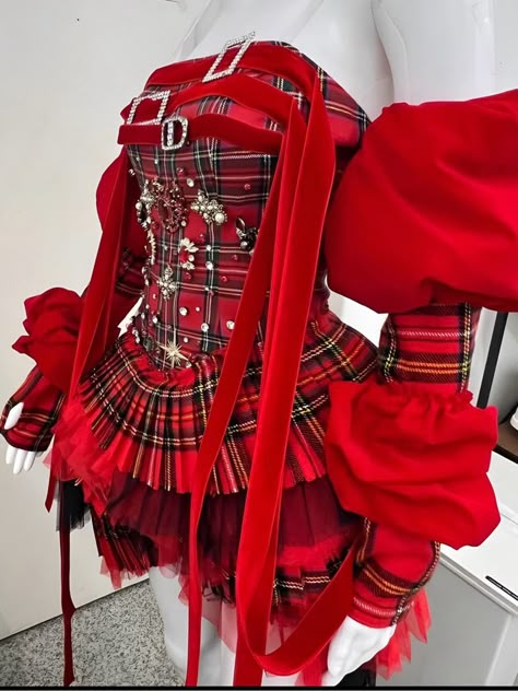 This dress features red plaid pattern. The fitted corset top is meticulously adorned with sparkling silver embellishments and ribbons. Layers of ruffles dance around the legs, offering movement and flair with every step. The detached puffed sleeves add an air of romanticism. Color: Red  Polyester material Fits true to Heart Themed Clothes, Candy Inspired Outfits, Red Performance Outfits, Big Red Dress, Clown Core Fashion, Red Fashion Editorial, Red And Pink Outfit, Red And Green Dress, Ruffle Dress Pattern