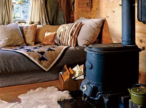 Gorgeous wood stoves you'll want to curl up near this winter - Cottage Life Tiny House Murphy Bed, Wood Shelves Living Room, Rustic Wood Shelving, Tiny House Furniture, Little Cabin In The Woods, Cabin Living Room, Tiny House Loft, Interior Design Rustic, Little Cabin