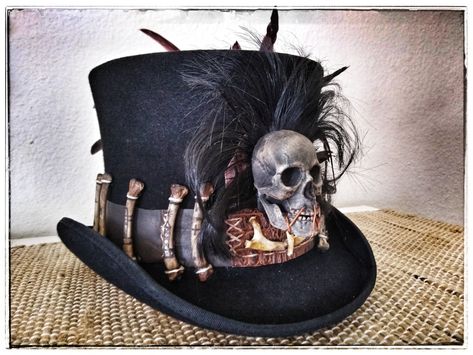 Commissioned Voodoo top hat with stitched leather, and faux aligator hat band, veve bones, Red/Black rooster feathers, and skull. Shop etsy Ghostfire68 Pixie Parasol, Voodoo Fashion, Voodoo Top Hat, Witch Doctor Costume, Skull Top Hat, Voodoo Costume, Voodoo Halloween, Voodoo Art, Diy Skulls