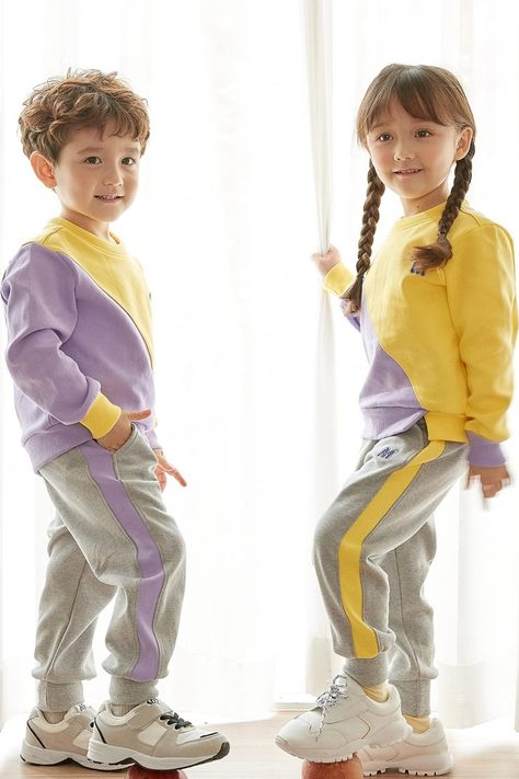 This clothing is made of a special fabric that quickly absorbs sweat and dries fast, making it perfect for top-notch quality children's sportswear. The fabric has a strong weave that takes care of children's skin while they wear it during physical activities. #kids #tracksuit Kids Tracksuits, Kids Sportswear, Jogger Set, Sport Wear, Winter Outfit, Physical Activities, Color Blocking, Winter Outfits, Fashion Forward