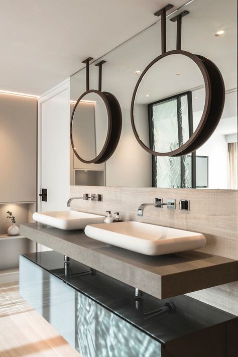 This beautiful bespoke vanity unit is part of the stunning bathroom in our Hampstead project

The bespoke bronze double mirrors hanging from the ceiling and are layered  with another mirror behind to add visual interest as well as to bounce light around the room

The shallow composite basins  by @copenhagen_bath as well as the @dornbracht_official wall mounted taps finish the scheme 

Click to see more inspiring design ideas Bathroom With Double Sink, Hanging Mirrors, Bespoke Bathroom, Joinery Design, Wall Mounted Taps, Double Mirror, London Interior, Stunning Bathrooms, Flat Ideas