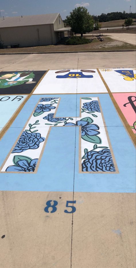 Alice In Wonderland Senior Parking Spot, Student Parking Lot Painting, Dinosaur Parking Spot, Blue And White Parking Spot, Volleyball Parking Spot Painting, Blue Parking Spot Ideas, Group Parking Spot Ideas, Senior Parking Spots Chalk, Senior Parking Spot Ideas Simple