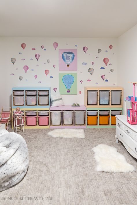 painted WOOD Ikea shelves with bins. Paint colors listed as well in this post Playroom Pastel Colors, Ikea Trofast Playroom Ideas, Ikea Trofast Painted, Trofast Playroom Ideas, Painted Trofast, Trofast Painted, Trofast Makeover, Trofast Kids Room, Ikea Trofast Playroom