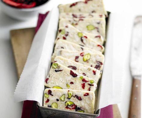 White chocolate, cranberry and pistachio hedgehog slice Hedgehog Slice, White Chocolate Desserts, Chocolate Cranberry, White Chocolate Recipes, Best Baking, Cranberry Pistachio, Baking Christmas, White Chocolate Cranberry, Christmas Lunch