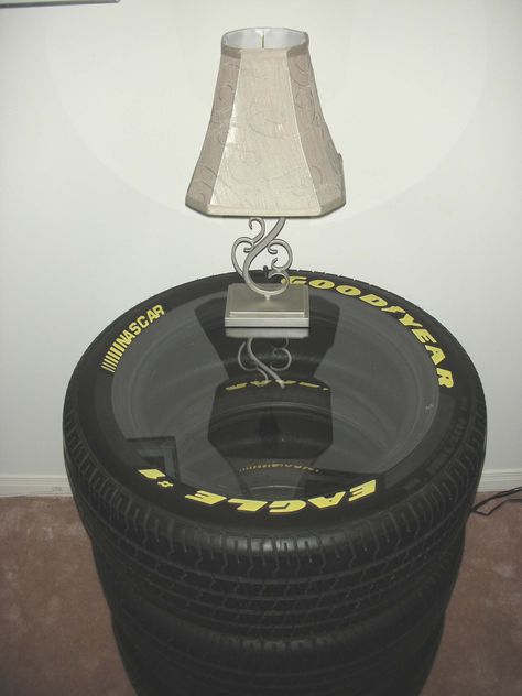 Created a sidetable from the NASCAR tires that use to be on my husband's muscle car! #paris8_can_decor8 #NASCAR Tires #side tables #man cave ideas Car Themed Man Cave Ideas, Car Bedside Table, Nascar Man Cave, Bedroom Ideas For Car Guys, Car Themed Furniture, Car Themed House, Nascar Room Ideas, Car Themed Room Man Caves, Car Guy Room Decor