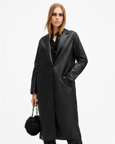 Up the ante in the Aire Coat. It's based on our bestselling Corrina Blazer but longer (just think, added drama). Made from soft leather, the single-breasted silhouette features slim fitting sleeves and vented details to mirror a classically tailored style. Complete with our AllSaints signature buttons, there's an ease to this statement silhouette that allows you to dress it up or keep it casual.  This leather jacket is designed to a regular fit Long sleeves Button closure Single breasted Long slim sleeves Vented back hem Two side pockets AllSaints branded buttons Fully lined All Saints Clothing, Slim Fit Coat, Tailored Style, Black Leather Coat, Collared Coat, Gothic Outfits, Going Out Outfits, Sweaters And Jeans, Black Leather Jacket