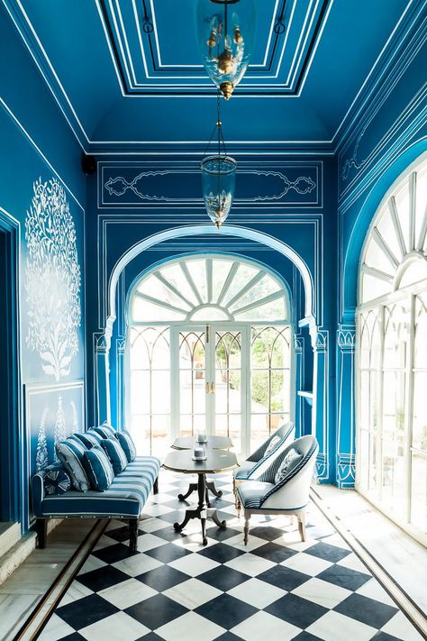 Bar Palladio black and white harlequin floor in Jaipur, India. Designed by Marie-Anne Oudejans, the sprawling azure grounds are a master class in monochromatic chic. Bar Palladio, Checkered Flooring, Ceiling Texture Types, Martini Bar, Saturated Blue, Victorian Cottage, Private Dining Room, Blue Rooms, Anne Marie