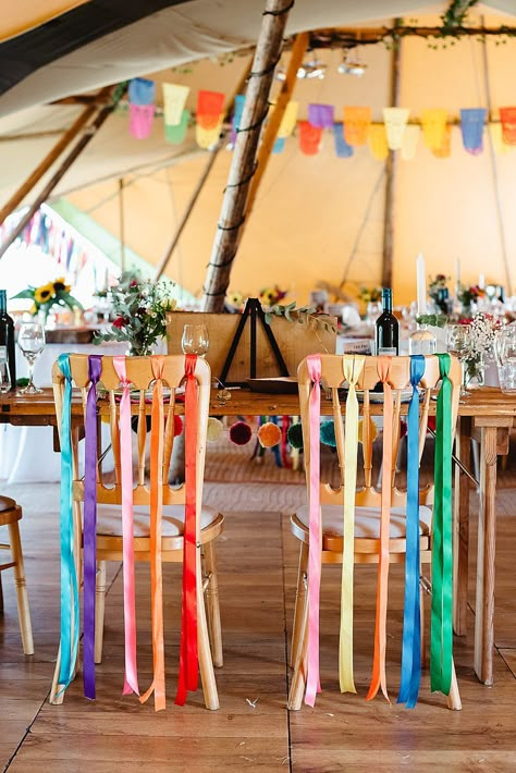 Colourful Wedding Decorations Diy, Ribbon Chair Decor, Boho Rug Wedding Ceremony, Ribbons On Chairs For Wedding, Ribbon Chairs Wedding, Chair Ribbons Wedding, Centerpieces Wedding Colorful, Colourful Boho Wedding, Colourful Party Decorations