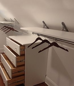 Angled Closet Ideas Sloped Ceiling, Slanted Closet Ideas, Attic Bedroom Designs Angled Ceilings, Slanted Wall Closet, Closet With Slanted Ceiling, Long Narrow Closet, Slanted Ceiling Closet, Closet Rod Bracket, Angled Wall