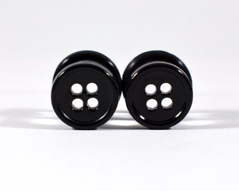 Black four hole button plugs.Mounted on clear plugs, light shines through the holes creating an eye-catching effect.Each pair is available in your choice ofAcrylic Single FlaredStainless Steel Single FlaredStainless Steel Double Flaredor Coco Wood Double Flared Plugs. Please see Images for examples of these styles. All Listings are for one Pair. Available in 2g, 0g, and 00gShown in  00g Plug Earrings Gauges, Earrings Gauges, Tapers And Plugs, Dangle Plugs, Ear Gauges Plugs, Cool Piercings, Ear Piercings Cartilage, Plug Earrings, Cute Piercings