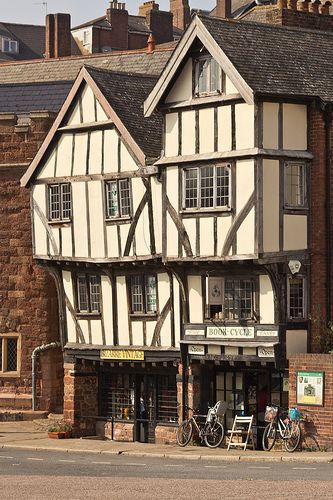 Tudor half-timbered buildings in Exeter Historic 15th century buildings in West Street located in Exeter's West Quarter. Help protect listed buildings. Essex. Tudor Buildings, Building Miniature, Tudor Houses, Tudor Architecture, Timber Frame Building, Exeter Devon, Medieval Buildings, Tudor Period, Tudor Era