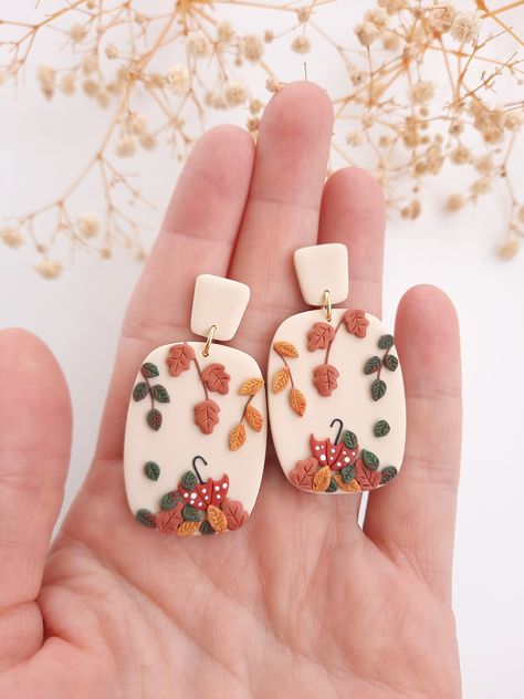 *Fall inspired earrings  Fall floral earrings |  Boho floral Statement earrings for autumn | Boho Autumn jewelry | fall leaf earrings | fall clay earrings | , Boho autumn jewelry | autumn leaf jewelry These are unique, handmade, polymer clay fall earrings.   A beautiful statement piece that is so comfortable, you'll forget you have them on! All findings are hypo-allergenic and nickel free. Please note: real colors may differ slightly from their appearance on your display. Please note that these are handmade items, slight variation may occur compared to the pictures Please feel free to contact me with any queries about my jewellery!  I hope, I make pleasure with my work:) Please check my other jewellery too: https://www.etsy.com/shop/Viviendesignstudio Clay Fall Earrings, Boho Autumn, Autumn Jewelry, Diy Earrings Polymer Clay, Handmade Clay Jewelry, Polymer Clay Jewelry Diy, Fall Leaf, Fall Earrings, Clay Jewelry Diy