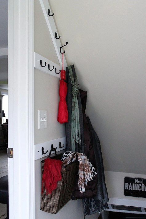 DIY angled stairwell coat rack | small home storage ideas | basement stair way space savers | stowandtellu.com | #basement #stairwell #stairway #storage #coat #rack #wall #hanging #hooks #basementideas Stairway Storage, Closet Under Stairs, Stairs Renovation, Stairs Storage, Coat Storage, Stairs Makeover, Under Stairs Cupboard, Diy Basement, Basement Storage