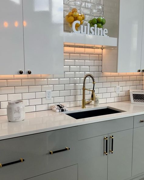 White Counters Black Sink, White Counter Black Sink, Black Sink White Counter, Black And Gold Hardware, Dark Grout, Cream Kitchen Cabinets, Two Tone Kitchen Cabinets, Cabin Renovation, Two Tone Cabinets