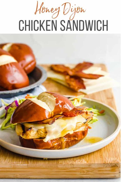 Top a pretzel bun with marinated, grilled chicken, Swiss cheese, cripsy bacon, and our Honey Dijon Sauce for the perfect sandwich! Freezing instructions included. #chicken #sandwiches #freezermeal #freezercooking #dinner Pretzel Bun Chicken Sandwich, Pretzel Buns Sandwich Ideas, Chicken Bacon Swiss Sandwich, Lunch Special Ideas Restaurant, Pretzel Bun Sandwich, Pretzel Buns Sandwich, Chicken Cutlet Sandwich, Chicken Bacon Sandwich, Cutlet Sandwich