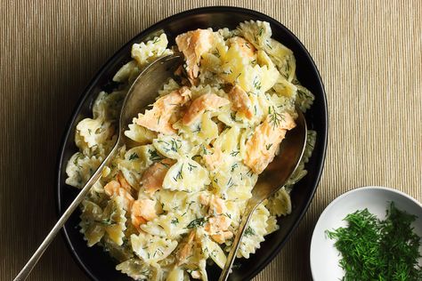 Simple but spectacular weeknight fare: seared salmon and bowtie pasta tossed in lemony ricotta and dill. Salmon Ricotta Pasta, Salmon And Ricotta Recipe, Mediterranean Salmon Pasta, Salmon Bowtie Pasta, Salmon Ricotta Recipes, Salmon Pasta Recipes Healthy, Salmon Ricotta, Ricotta Pasta Recipes, Salmon Pasta Recipes