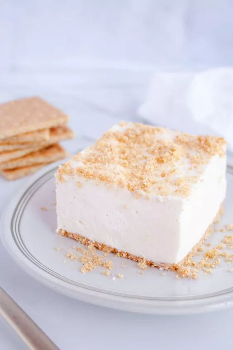 This Graham Cracker Fluff is an old-fashioned dessert made with a simple sweet custard & whipped cream on top of a graham cracker crust. Don’t let the simplicity fool you, this dessert is out of this world! I’m lucky enough to be writing this post sitting on a picnic table on the shore of Bear Island Lake in northern Minnesota. My grandpa built our cabin here in the late 1950’s, when my mom was just a kid. She grew up loving this place and passed that love onto me. During my childhoo… Graham Cracker Fluff Amish, Desserts With Graham Cracker Crumbs, Gram Cracker Recipe, Gram Cracker Crust Desserts, Graham Cracker Fluff, Desserts With Graham Cracker Crust, Dessert Fluff, Graham Cracker Crust Dessert, Fluff Recipes