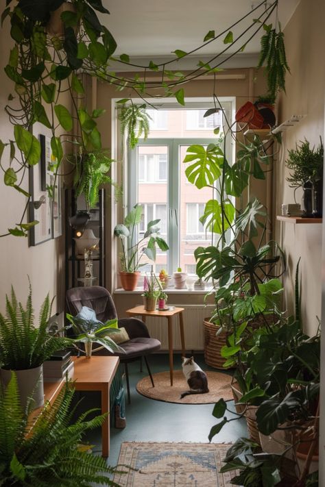 Experience the beauty of an urban jungle with this apartment tour showcasing a variety of indoor plants. Discover how to style your space with greenery while creating a cozy, nature-inspired retreat. Cozy Plant Apartment Aesthetic, Room Decorated With Plants, Studio Apartment With Plants, Living Room With Plants Ideas Cozy, Cozy Plant Apartment, Earthy House Interior, Plant Living Room Aesthetic, Library With Plants, Black Vanity Ideas