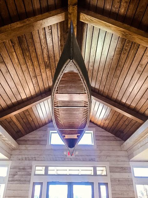 We turned this canoe into a light fixture in this lakefront clubhouse. Canoe On Ceiling, Canoe Chandelier, Canoe Shelf, Lakehouse Living Room, Barn House Interior, Nautical Interior, Photography Interior, Light Decor, Hospital Interior Design