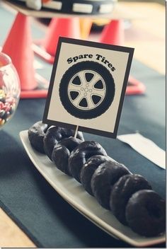 Race Car Birthday Party - Spare "Tire" Donuts #forthekids #carlovers #futurehoseltoncustomers Car Donuts Spare Tires, Car Theme Gender Reveal, Nascar Baby Shower Ideas, Car Baby Shower Ideas, Car Gender Reveal Ideas, Wheels Or Heels Gender Reveal, Nascar Party, Spare Tires, Cars Birthday Party