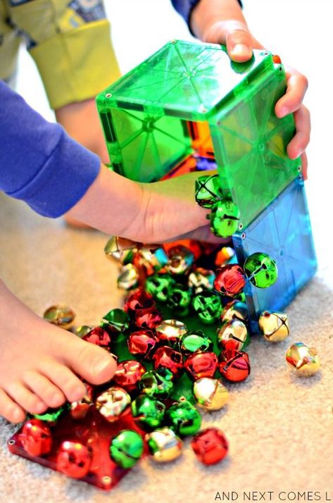 Christmas science for toddlers and preschoolers using Magna-Tiles and jingle bells from And Next Comes L Stem Activity For Kids, Christmas Science Activities, Christmas Stem Activities, Christmas Activities For Toddlers, Christmas Learning, Science For Toddlers, Preschool Christmas Activities, Magna Tiles, Christmas Units