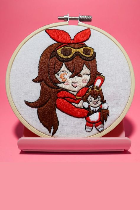 This is an embroidery of Amber from Genshin Impact. She is holding Barron Bunny. It is of her top half and hand stitched. It is in a 4 inch embroidery hoop. Genshin Impact Embroidery, Genshin Embroidery, Amber Genshin Impact, Amber Genshin, Fashion Design Classes, Embroidery Wall, Embroidery Wall Art, Embroidery Projects, Embroidery Art