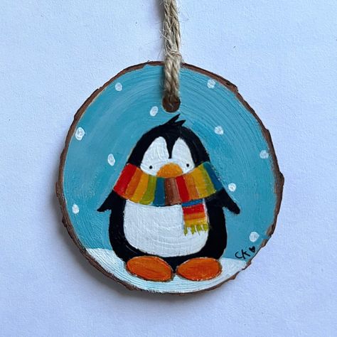 Hand painted penguin decoration  Original Art on a wooden slice Approx 6cm x 6cm Initialled on the front and signed on the back Painting On Wooden Circles, Hand Painted Nativity Ornament, Wood Ornament Ideas Diy Christmas, Painted Penguin Ornaments, Cute Wooden Ornaments, Christmas Wooden Slices, Christmas Ornaments Painting Ideas, Painted Wood Slices Christmas, Christmas Painted Wood Slices