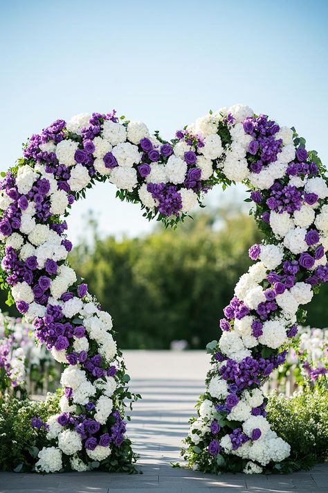 Purple and White Flower Arch. Unleash your inner florist with wild and whimsical floral wedding ideas that will make your special day bloom like never before. Wisteria Flower Wedding Decor, White Flower Arch, Whimsical Floral Wedding, Floral Wedding Ideas, Floral Wedding Decor, Floral Arch Wedding, Flower Arch, Floral Wedding Cake, Floral Wedding Decorations