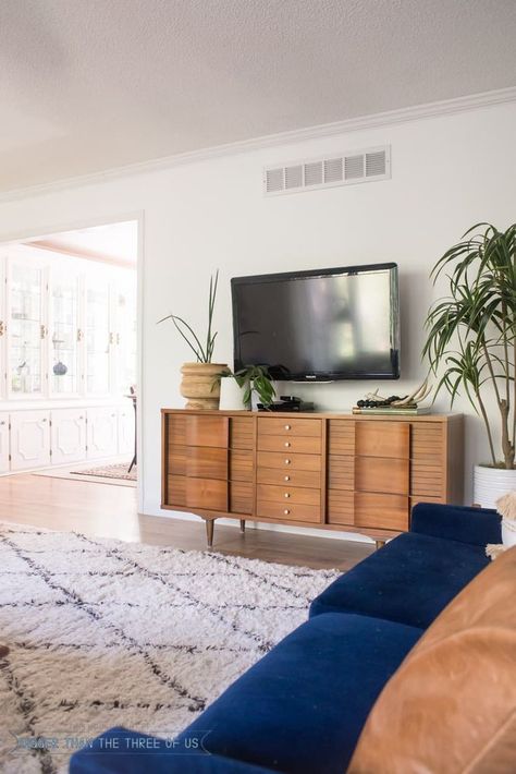 Styling Around a Wall-Mounted TV + media cabinet  #tvcabinet #livingroom Styling A Mounted Tv, Mounted Tv Styling, Credenza Under Wall Mounted Tv, Offset Tv In Living Room, Sideboard Under Tv On Wall, Under Tv Styling, Mcm Tv Wall, Sideboard Under Tv, Bedroom With Tv Ideas