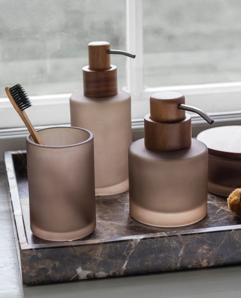 Transform your bathroom with the elegant MODEST series, available in warm walnut and soft kit. ⁠ ⁠ The collection features a low and tall soap dispenser, a sleek toothbrush holder, and a lidded jar. The dispensers and jar combine matte glass with smooth wood, offering a modern and soft look, while the toothbrush holder stands out with its minimalist, matte glass design. ⁠ ⁠ Whether you're organising your bathroom essentials or simply adding style, MODEST brings refined, understated luxury to ... Soap Dispenser Tray, Kitchen Roll Holder, Bedroom Cushions, Kitchen Soap, Kitchen Soap Dispenser, Visual Aesthetics, Kitchen Roll, Dishwashing Liquid, Toilet Brush