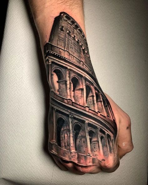 Colosseum hand tattoo by Fabietto Leon, done at Inkubo Tattoo Studio in Mariano Comense, Italy. Roman Colosseum Tattoo, Colosseum Tattoo, Rome Tattoo, Tiger Hand Tattoo, Unique Hand Tattoos, Urban Tattoos, Italian Tattoos, Butterfly Hand Tattoo, Rose Hand Tattoo