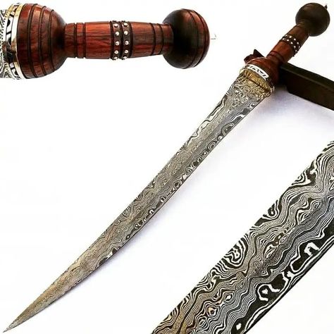 Cutlass Sword- High Carbon Damascus Steel Sword- 37″- Saber/ Sabre Blade Material: High-carbon Damascus steel Blade Length: 37 inches (94 cm) Blade Thickness: 0.3 inches (7.6 mm) Blade Type: Single-handed cutlass saber Handle Material: Wooden or synthetic materials (optional) Handle Length: 8 inches (20.3 cm) Weight: Approximately 3.5 lbs (1.59 kg) Balance Point: 5 inches (12.7 cm) from the guard Guard and Pommel: Forged steel Scabbard: Leather or wood The Guard, Synthetic Materials, Forged Steel, Damascus Steel, Wood, Leather, Art