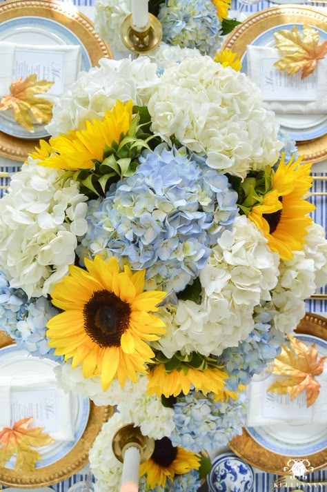 Big floral centerpiece for table ideas in hosting Thanksgiving Dinner- Sunflowers with blue and white hydrangeas in blue and white ginger jars - Kelley Nan Sunflower Centerpieces, Sunflower Themed Wedding, White Hydrangeas, Fall Flower Arrangements, Dusty Blue Bridesmaid Dresses, Yellow Sunflowers, August Wedding, Sunflower Bouquets, בר מצווה