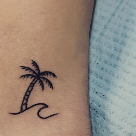 Palm Tree & Wave minimalist tattoo Palm And Wave Tattoo, Wave Tattoo With Palm Tree, Palm Tree Henna Tattoo, Wave Tree Tattoo, Small Palm Tree And Wave Tattoo, Wave With Palm Tree Tattoo, Palm Tree Tattoo Minimalist, Little Palm Tree Tattoo, Palm Tree Wave Tattoo