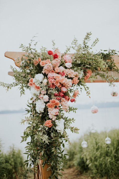 Peach And Pink Wedding Backdrop, Peach And White Wedding Florals, Orange Pink Coral Wedding Flowers, Peach Arbor Flowers, Coral Wedding Florals, Peach Wildflower Wedding, Coral Colored Flowers, Soft Peach Wedding Theme, Summer Wedding Arbor