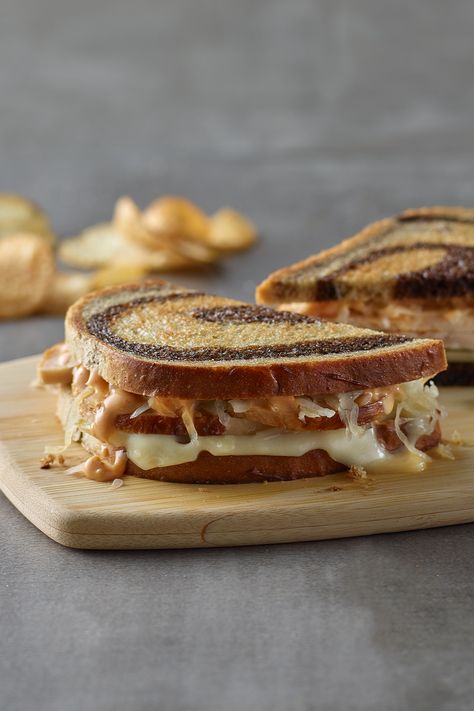 A toasted Rachel Sandwich sitting on a wooden cutting board Marble Rye Bread Sandwiches, Marble Rye Bread, Thousand Island Salad, Rachel Sandwich, Rye Bread Sandwiches, Marble Bread, Island Salad, Panini Bread, Easy Shepherds Pie