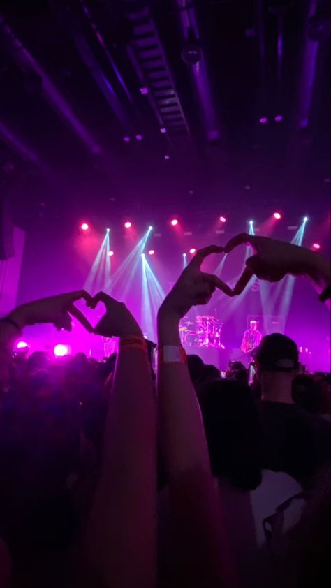 The Vamps Greatest Hits Tour in Bangkok, Samyan Mitrtown Hall, 10 February 2023. Making heart hands signs at concert, hand picture posing, concert photo ideas, posing inspo, The Vamps, Brad Simpson, Connor Ball, Tristan Evans, James McVey, Purple concert lights, purple neon aesthetic, neon lights, small gig venues, nostalgia, core memory, y2k aesthetic, bands, british band, world tour, purple computer background, purple wallpaper, neon screensaver The Vamps Concert Aesthetic, Purple Computer Background, Purple Wallpaper Neon, Small Concert Aesthetic, Purple Neon Aesthetic, Aesthetic Neon Lights, Purple Concert, Purple Computer, Concert Photo Ideas