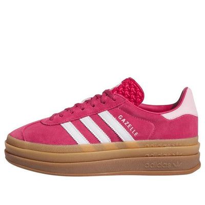 The adidas Gazelle Bold 'Wild Pink' is a vibrant update on the classic silhouette. Featuring a deep pink suede upper with signature T-toe overlay, serrated white leather stripes, and gum rubber soles, these sneakers offer a bold and stylish look. The triple-stacked gum rubber sole with embossed adidas branding provides traction and a vintage touch. Color Shoes, Pink Gazzels, Pink Dunks, Fun Shoes, Gazelle Bold, Adidas Gazelle Bold, Pink And Blue Adidas Gazelle, Adidas Gazelle Bold Pink Glow, Cheap Pink Adidas Sneakers