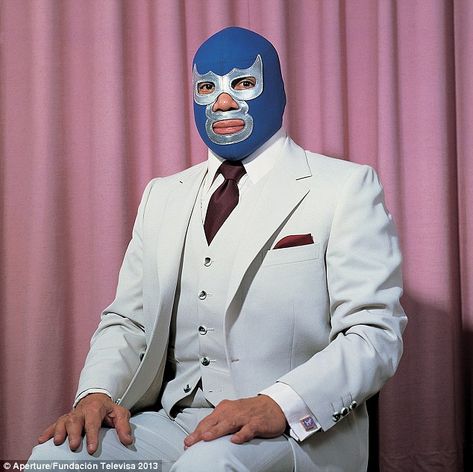 Proud fighter: The Mexican luchador and professional wrestler Blue Demon sits proudly in front of a colorful curtain (Lourdes Grobet, 1980) Mexican Wrestler, Foto Transfer, Blue Demon, Drop Cloth Curtains, Latin American Art, Victorian Lace, Professional Wrestler, Mexican Culture, Colorful Curtains