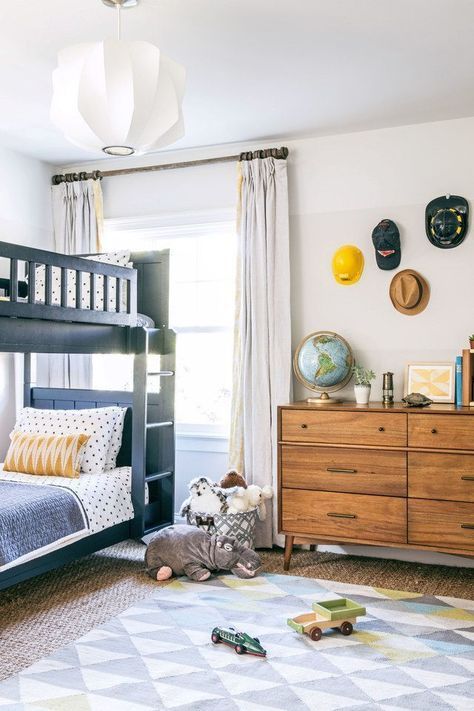 The boys’ room was painted in various Benjamin Moore whites to create a subtle ombré effect. The navy-blue bunk bed is from Pottery Barn Kids, and the sideboard is West Elm. Benjamin Moore Whites, Modern Bunk Beds, Big Kids Room, Bunk Bed Designs, Kids Bunk Beds, Big Boy Room, Loft Spaces, Boys Bedrooms, Kids Room Design