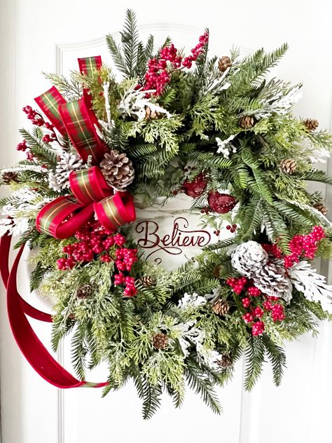 Christmas Wreath, Holiday Wreath, Winter Wreath, Red Bird Wreath, Farmhouse Wreath, Wreath with Cardinals, Front Door Wreath< Farmhouse Decor, Christmas Decoration, Holiday Decor, Decorating Idea, Christmas Gift for Her Be the envy of all your friends with this big beautiful wreath as part of your! This wreath is made on a 18" evergreen wreath base. Loads of Hemlock, cedar with pine cones, and snow covered cedar make this one full, fluffy and very real looking. The red berries make it pop and look great with the beautiful farmhouse "Believe" sign. Snow covered pine cones really give it that farmhouse feel. The beautiful is hand tied with designer ribbon, and completes the look for this one.  I recommend this one be displayed inside over a mantel, or on a door that is covered. Also, know th Full Christmas Wreath, Wreath With Poinsettias, Christmas Cardinal Wreath, Xmas Wreaths For Front Door, Real Christmas Wreath, Wreath With Cardinals, Wreath With Birds, Real Christmas Wreaths, Red Bird Wreath