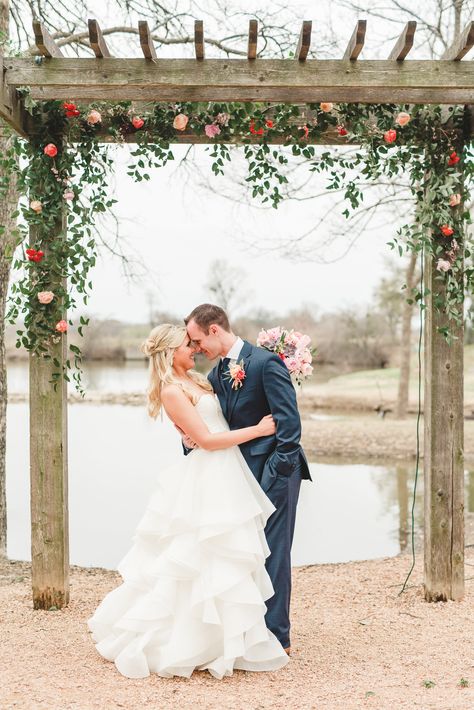 Smilax vine arbor with pops of peach & coral flowers for outdoor Texas wedding. Lindsay Davenport Photography. Wooden Wedding Arch With Flowers, Arbor Greenery, Vine Arbor, Smilax Vine, Trellis Wedding, Peach Blush Wedding, Lindsay Davenport, Wedding Trellis, Wooden Wedding Arches