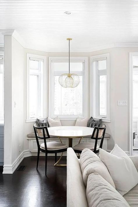 Breakfast Nook In Bay Window, Bay Window Built In Bench, French Breakfast Nook, Bay Window Dining Table, Black Cane Dining Chairs, How To Decorate A Bay Window, Breakfast Nook Ideas Bay Window, Window Breakfast Nook, Small Bay Window