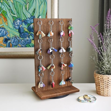 Product Details Versatile wooden jewelry organizer display for selling Each side has 16 long hooks for hanging and displaying accessories and jewelry. Keychain Display Stand, Rotating Organizer, Wooden Jewelry Stand, Wooden Jewelry Display, Multiple Necklaces, Earring Displays, Keychain Display, Earthy Jewelry, Craft Display