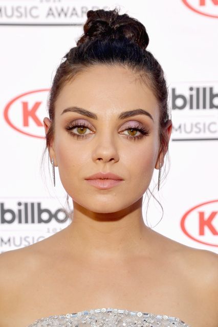 The Most Slay-Worthy Beauty Looks From The 2016 Billboard Music Awards #refinery29  http://www.refinery29.com/2016/05/111630/best-makeup-billboard-music-awards-2016#slide-10  Mila KunisIf this is what part of the Bad Moms squad looks like, then sign us up. Mila’s topknot, strong brow, and shot of lilac shadow adds a new twist to boss beauty.... Protruding Eyes, Purple Eye Makeup, Billboard Music, Mila Kunis, Beauty Regimen, Beauty Looks, Billboard Music Awards, Oily Hair, Ingrown Hair