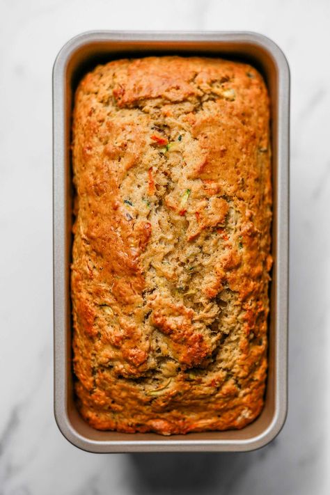 You'll love this light and fluffy Sourdough Discard Zucchini Carrot Bread with pistachios and an icing drizzle for perfect sweetness and texture. This bread is ideal for any spring or summer get-together. Pair it with coffee or tea for a lovely afternoon snack. #zucchini #carrot #bread Cajun Recipes Authentic, Zucchini Carrot Bread, Peach Kombucha, Carrot Zucchini Bread, Icing Drizzle, Cajun Sausage Pasta, Carrot Zucchini Muffins, Braised Leeks, Zucchini Carrot